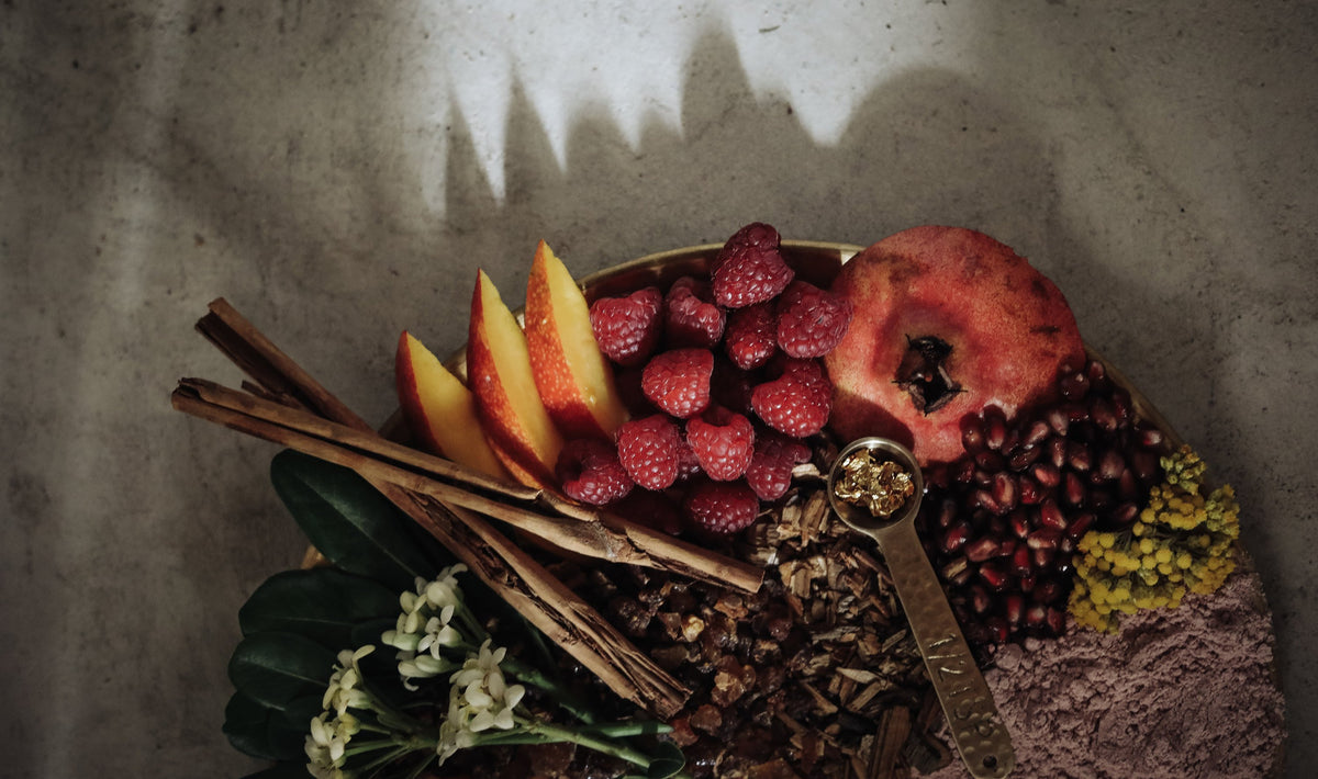 flatlay of mango, pomegranate and cinnamon